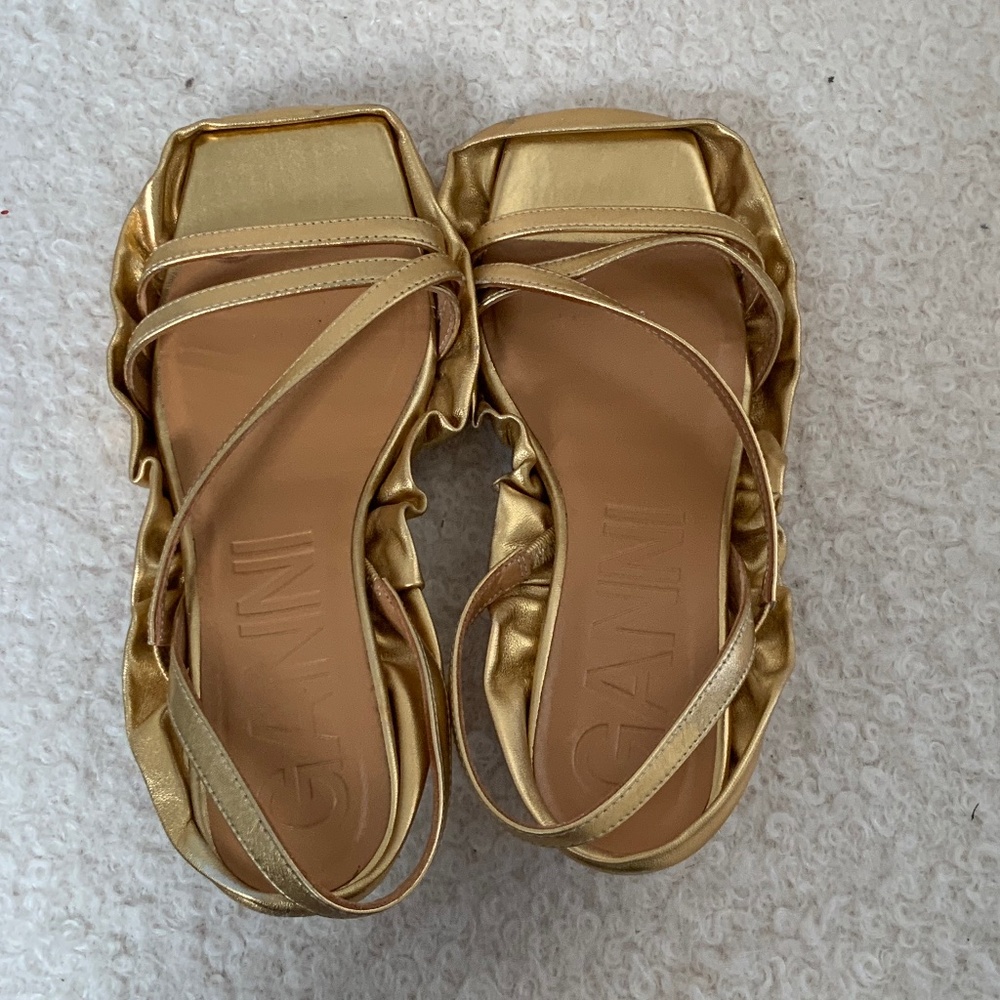 Ganni bright gold leather sandals with side fluting
